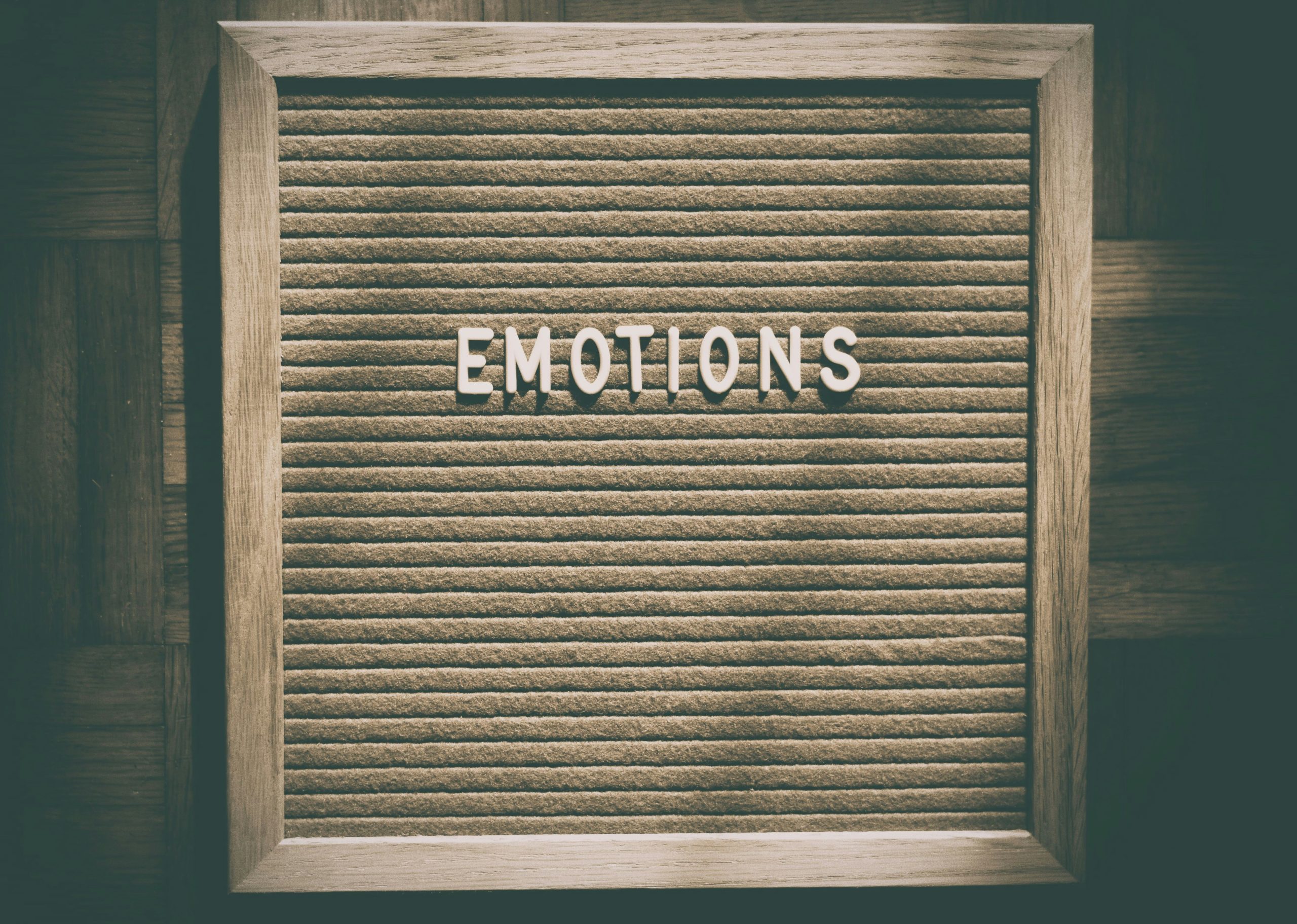alexas_fotos-WoPxj4W58C0-unsplash Board with the word emotions on it